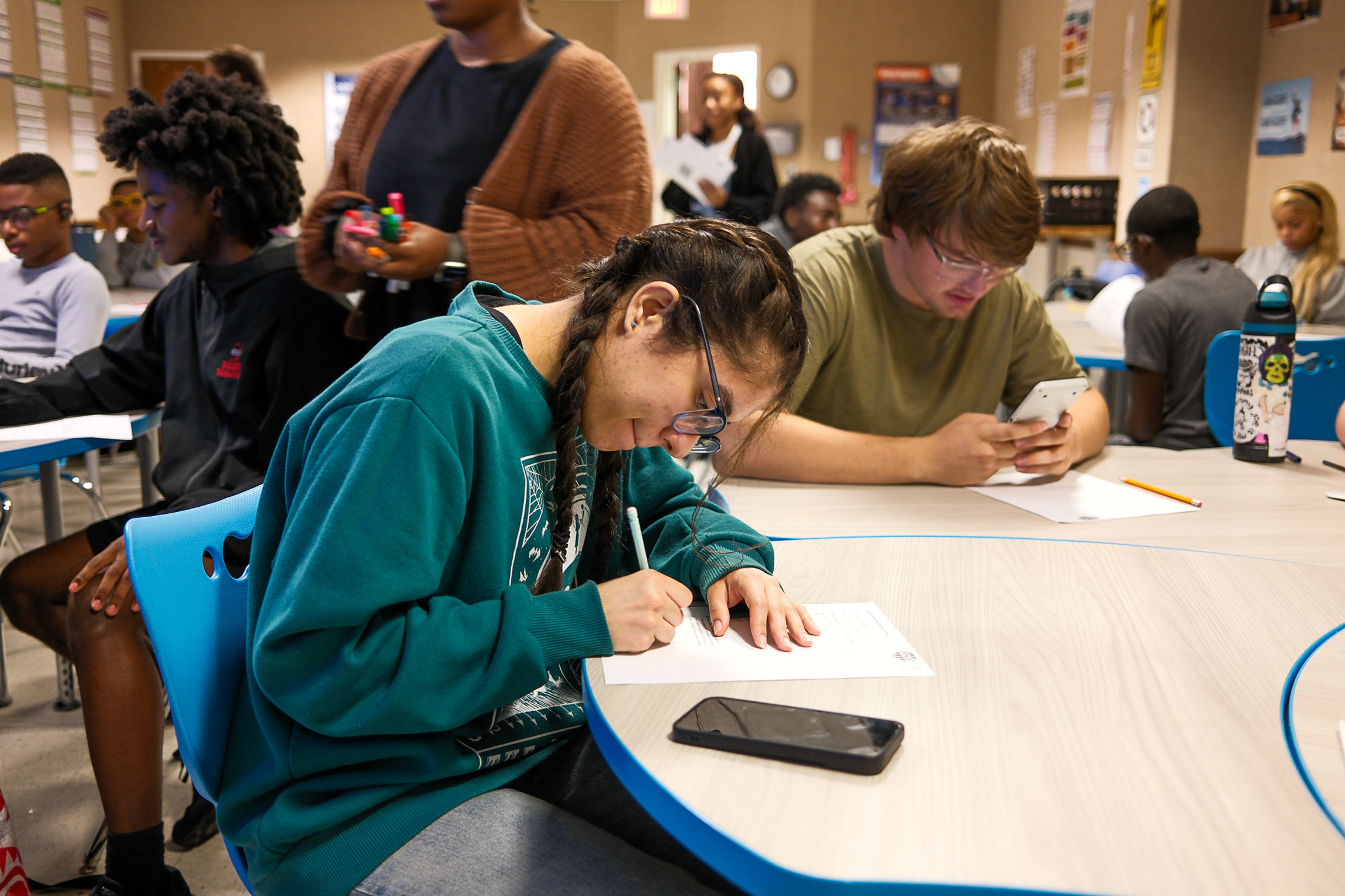Students working together at a table during an ACT prep session